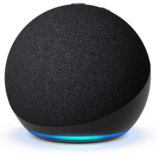 The Amazon Echo Dot smart speaker. A dark grey spherical speaker emitting a blue-turquoise light from its base.