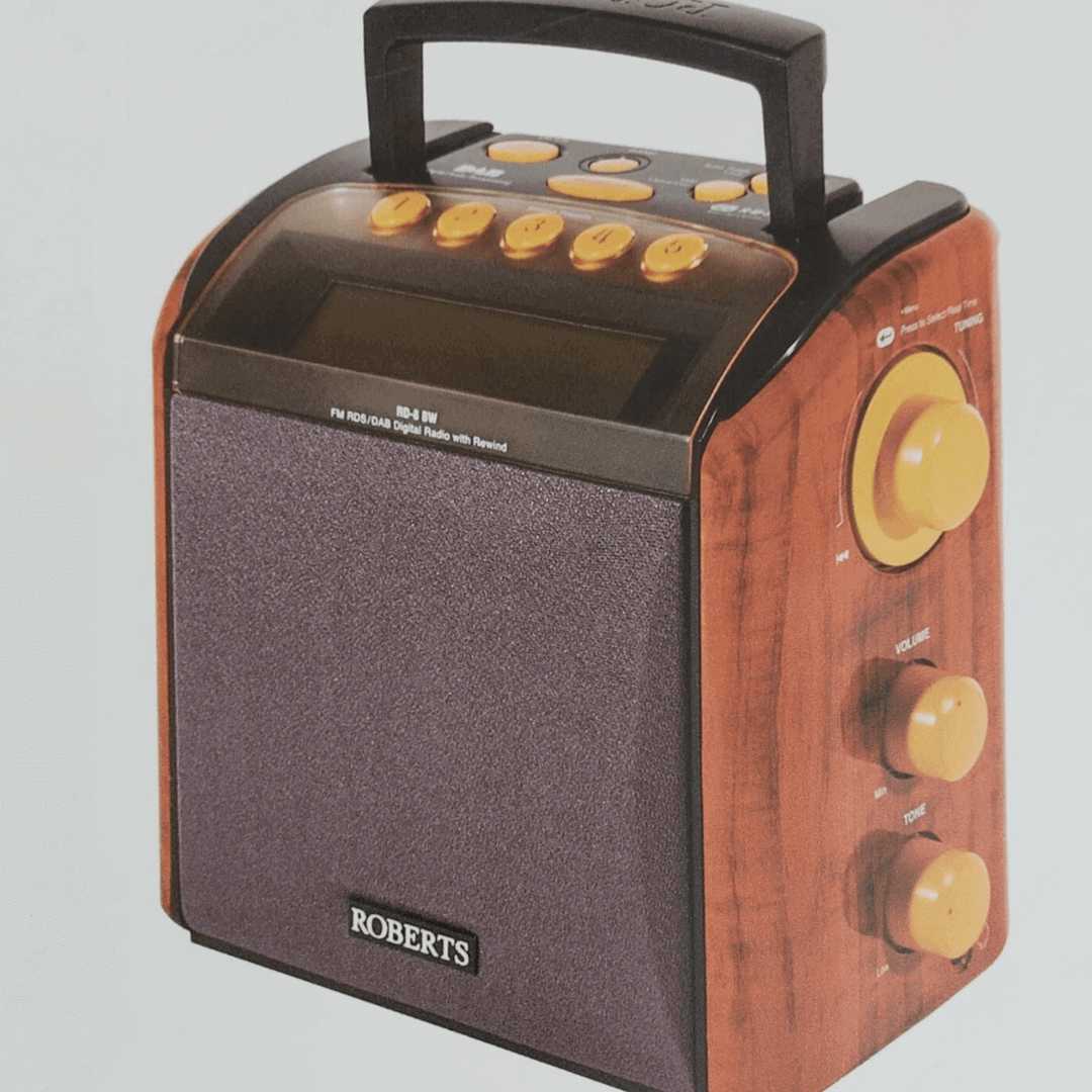 A wooden Roberts Radio Duet 2, featuring a large LCD display, yellow on black controls and a speaker at the front.