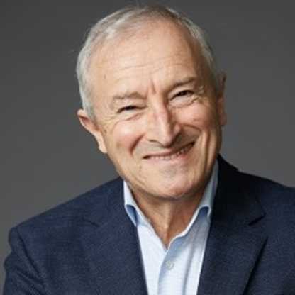 BWBF Patron Jim Rosenthal is wearing a dark suit and light shirt. He is smiling broadly.