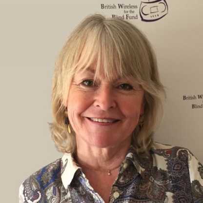 BWBF Patron Sue Cook is smiling to camera. She has blonde hair and is wearing a patterned shirt.