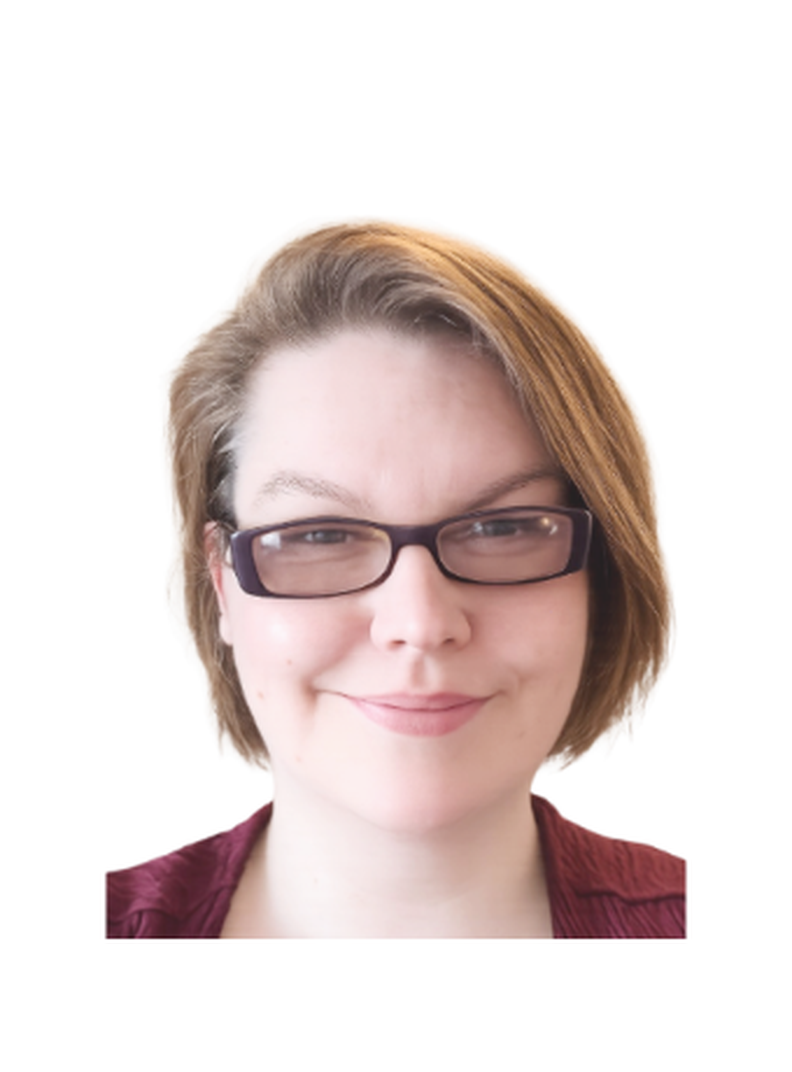 Sam, Volunteer and Projects Coordinator, smiling at the camera. She has short light brown hair, wears glasses and a red top, against a plain light background.
