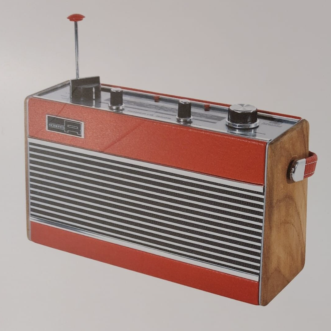 A photo of a red leather Roberts Radio R505 (issued 1974). It has controls at the top and a speaker on the front.