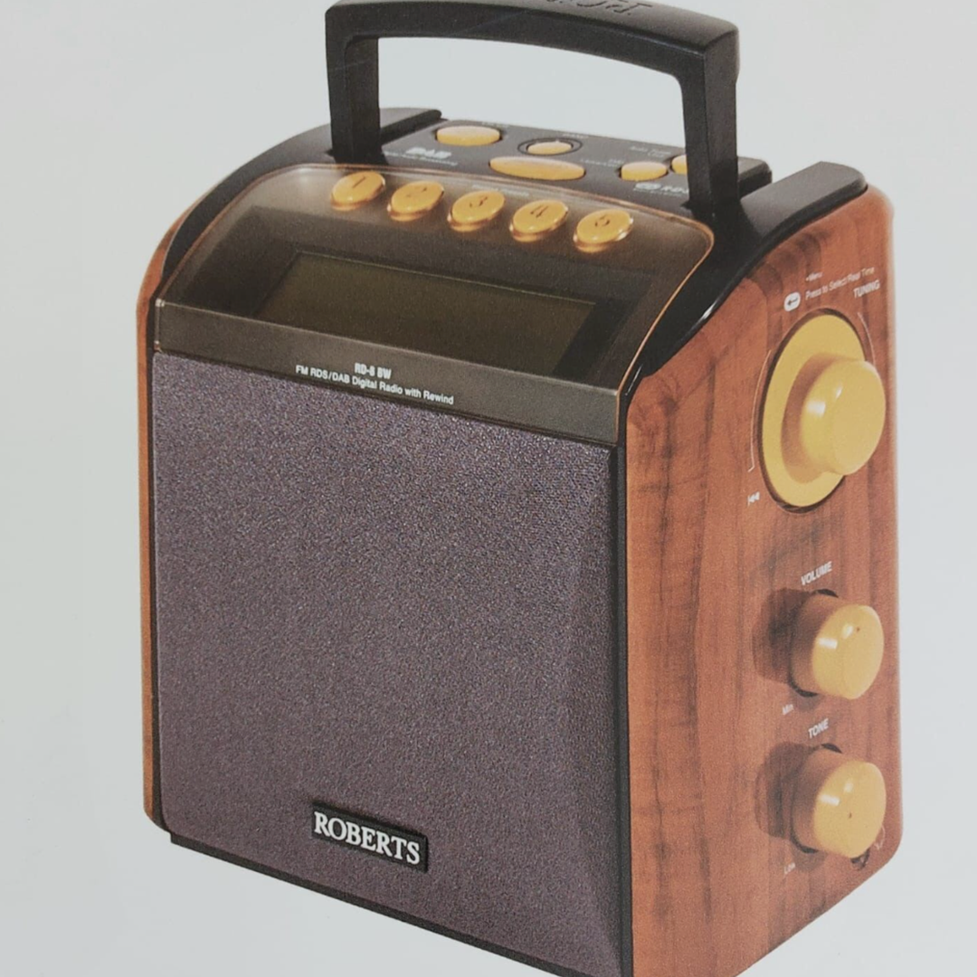 A wooden Roberts Radio Duet 2, featuring a large LCD display, yellow on black controls and a speaker at the front.